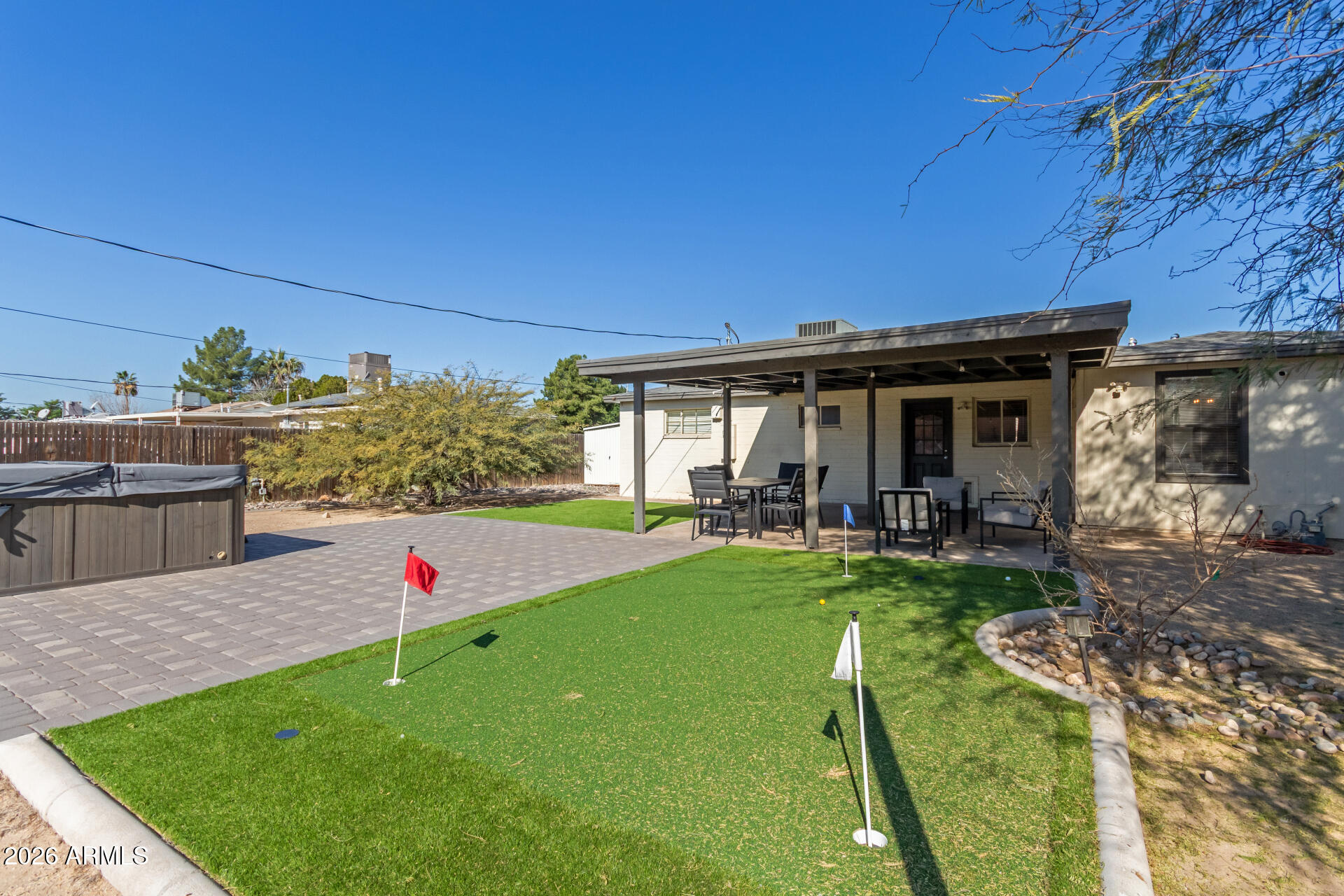 2715 West Royal Palm Road Phoenix, AZ 85051 - Photo 31 of 32 a view of a house with backyard porch and sitting area