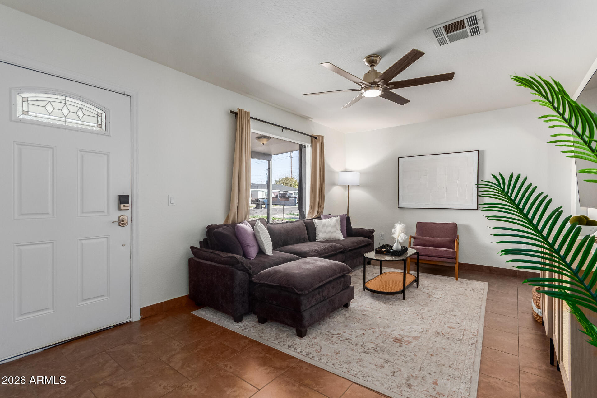 2715 West Royal Palm Road Phoenix, AZ 85051 - Photo 8 of 32 a living room with furniture and a window