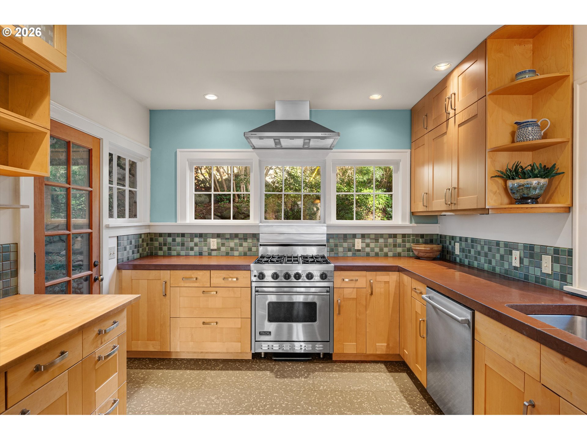 2783 Northeast Wiberg Lane Portland, OR 97213 - Photo 23 of 48 a kitchen with stainless steel appliances granite countertop a stove and a kitchen island