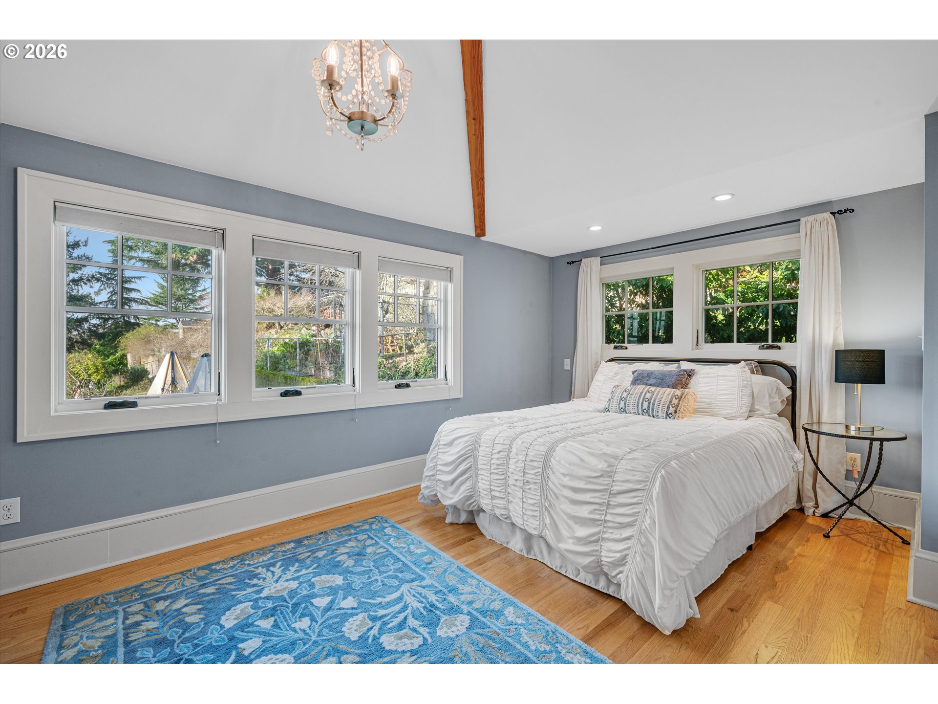 2783 Northeast Wiberg Lane Portland, OR 97213 - Photo 30 of 48 a bedroom with a bed and a large window