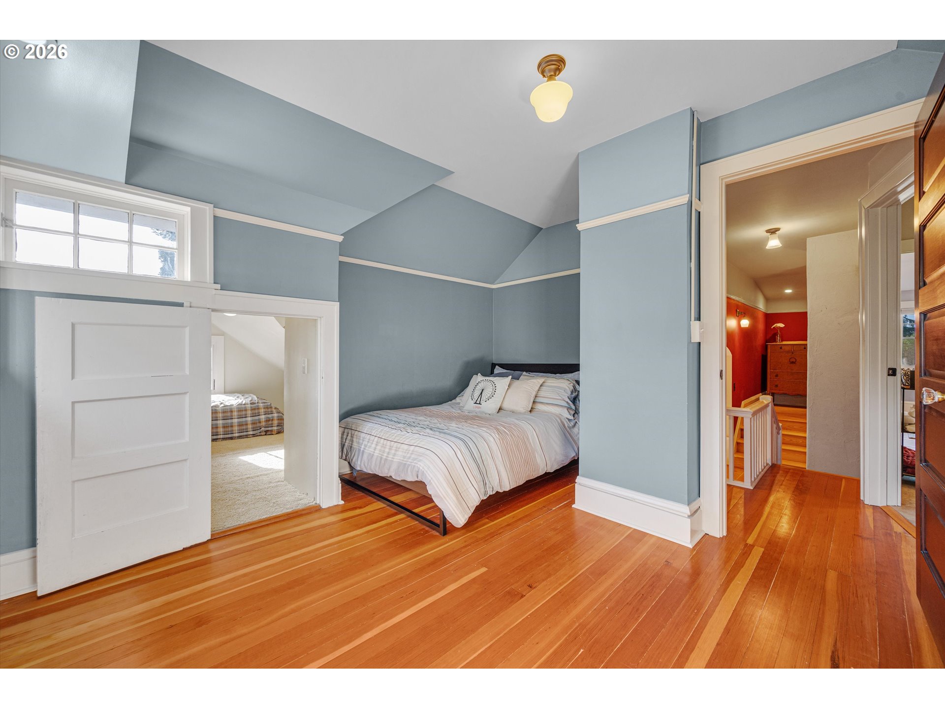 2783 Northeast Wiberg Lane Portland, OR 97213 - Photo 34 of 48 a bedroom with a bed and wooden floor