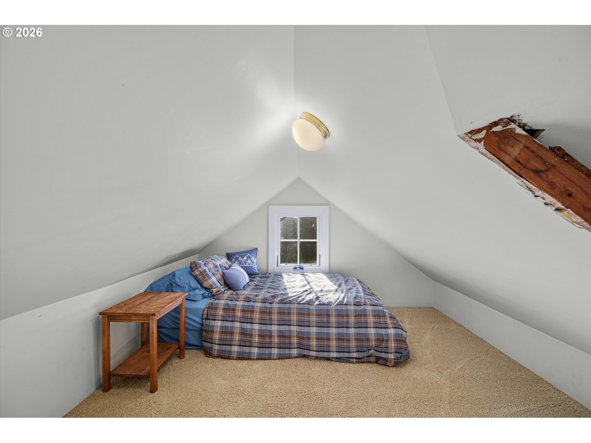 2783 Northeast Wiberg Lane Portland, OR 97213 - Photo 36 of 48 a bedroom with a bed and window