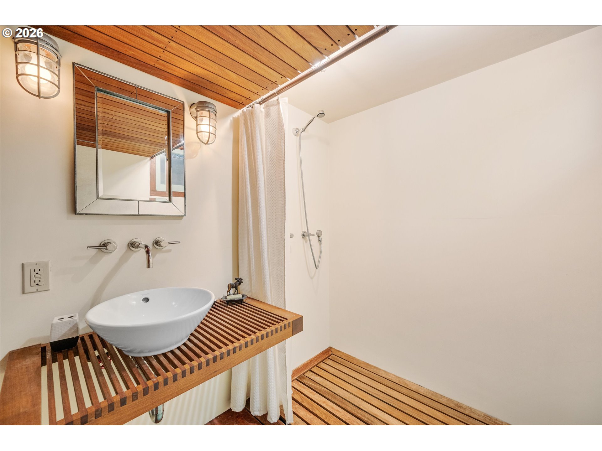 2783 Northeast Wiberg Lane Portland, OR 97213 - Photo 45 of 48 a bathroom with a sink and a mirror