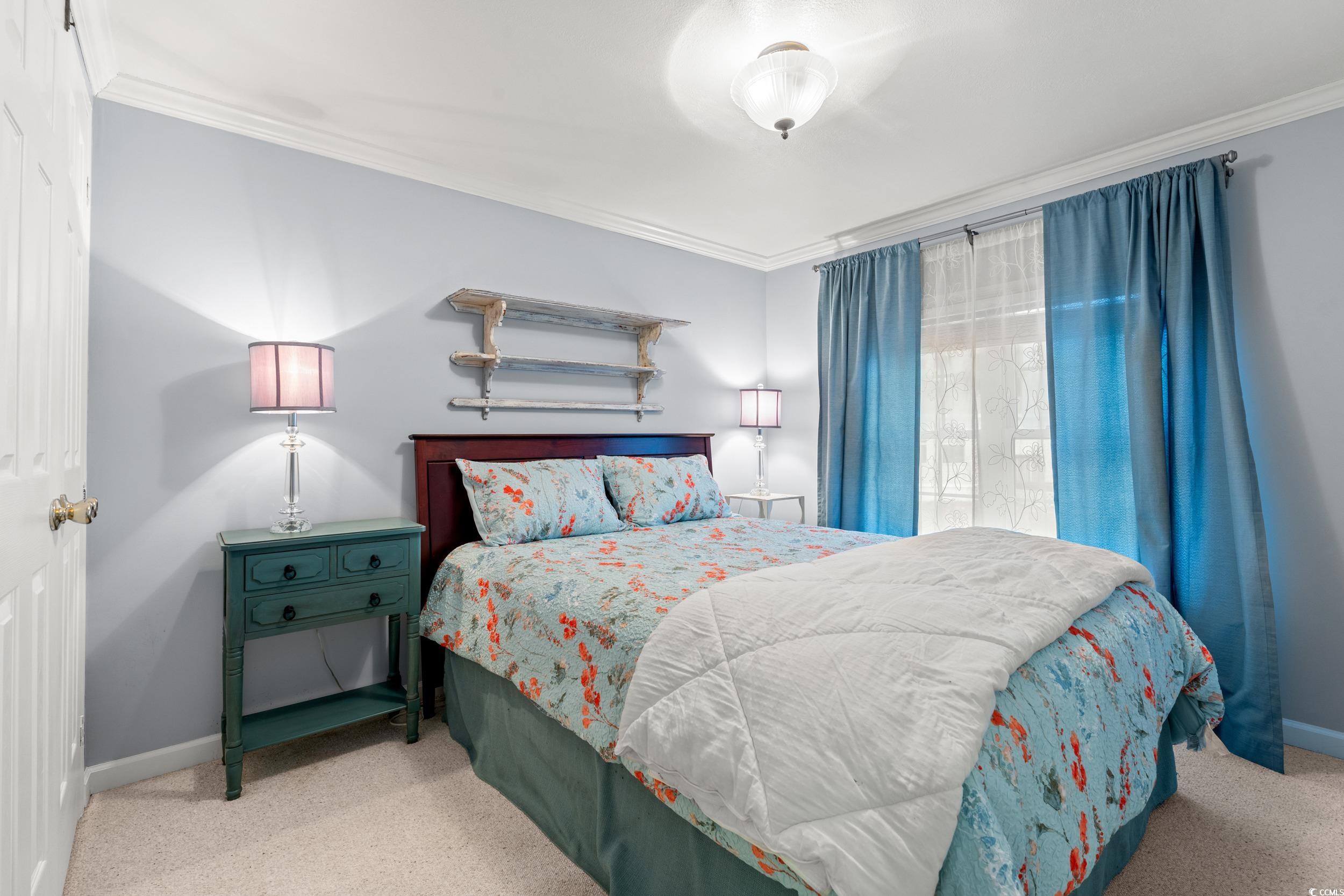 467 Freedom Circle Myrtle Beach, SC 29588 - Photo 13 of 38 Bedroom with ornamental molding and carpet floors