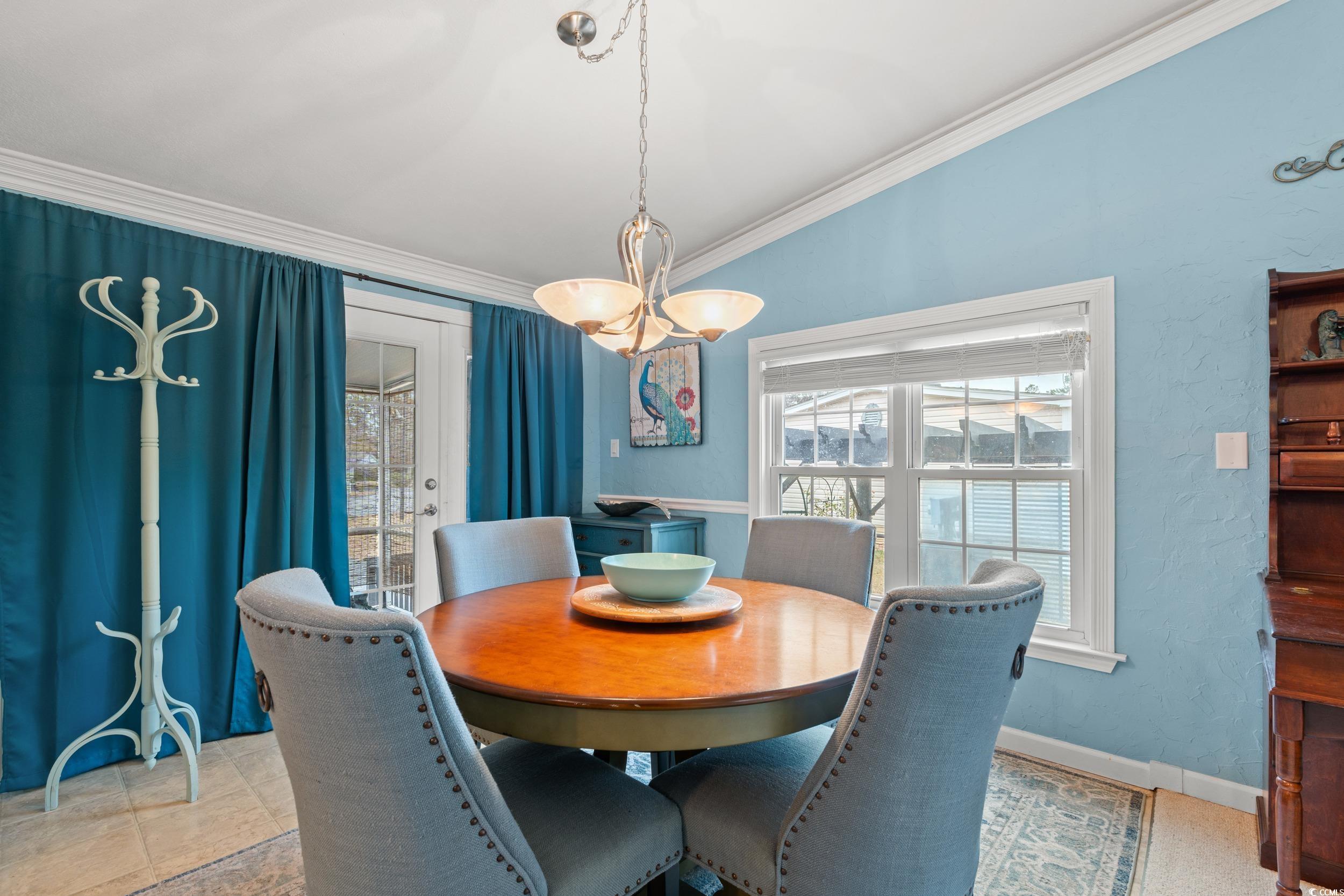 467 Freedom Circle Myrtle Beach, SC 29588 - Photo 14 of 38 Dining space with crown molding and baseboards