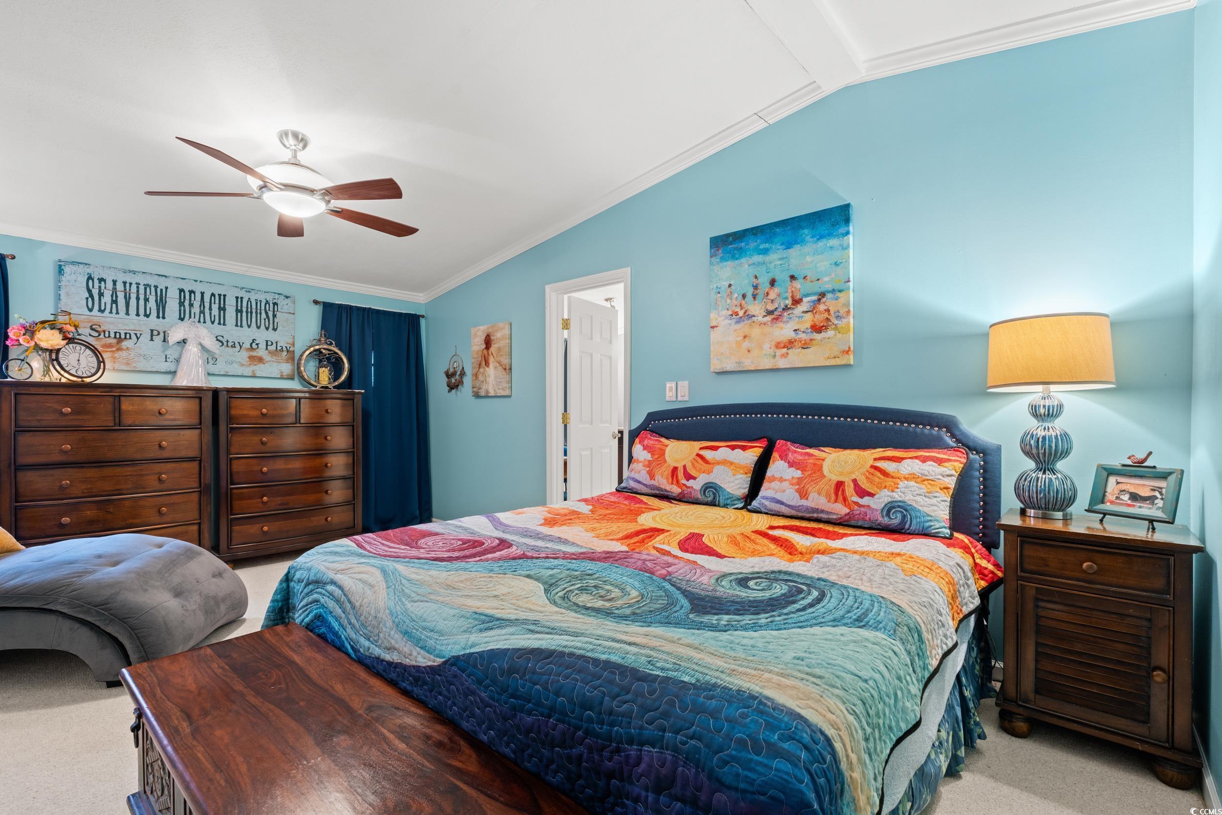 467 Freedom Circle Myrtle Beach, SC 29588 - Photo 18 of 38 Bedroom with carpet floors, crown molding, lofted ceiling, and a ceiling fan