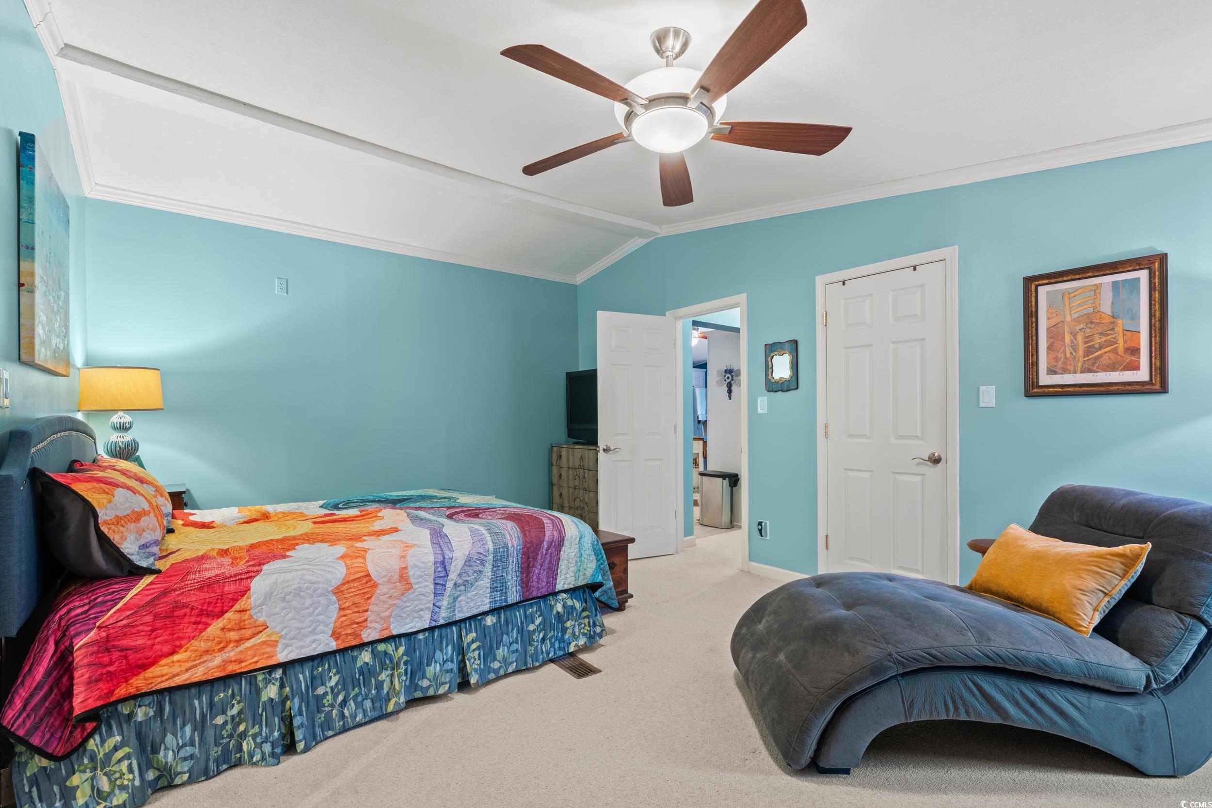467 Freedom Circle Myrtle Beach, SC 29588 - Photo 19 of 38 Bedroom with lofted ceiling, carpet, a ceiling fan, and crown molding