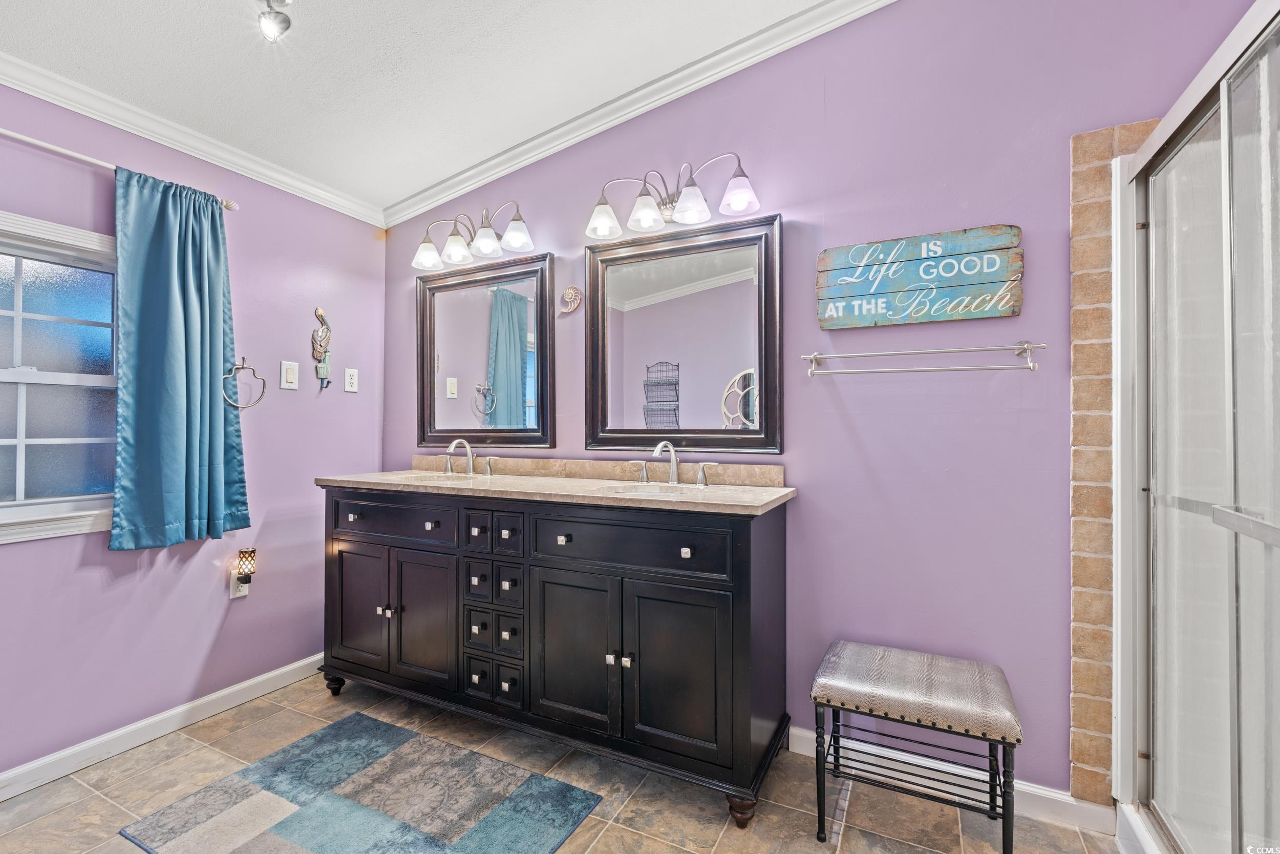 467 Freedom Circle Myrtle Beach, SC 29588 - Photo 20 of 38 Full bath with ornamental molding, double vanity, and a stall shower