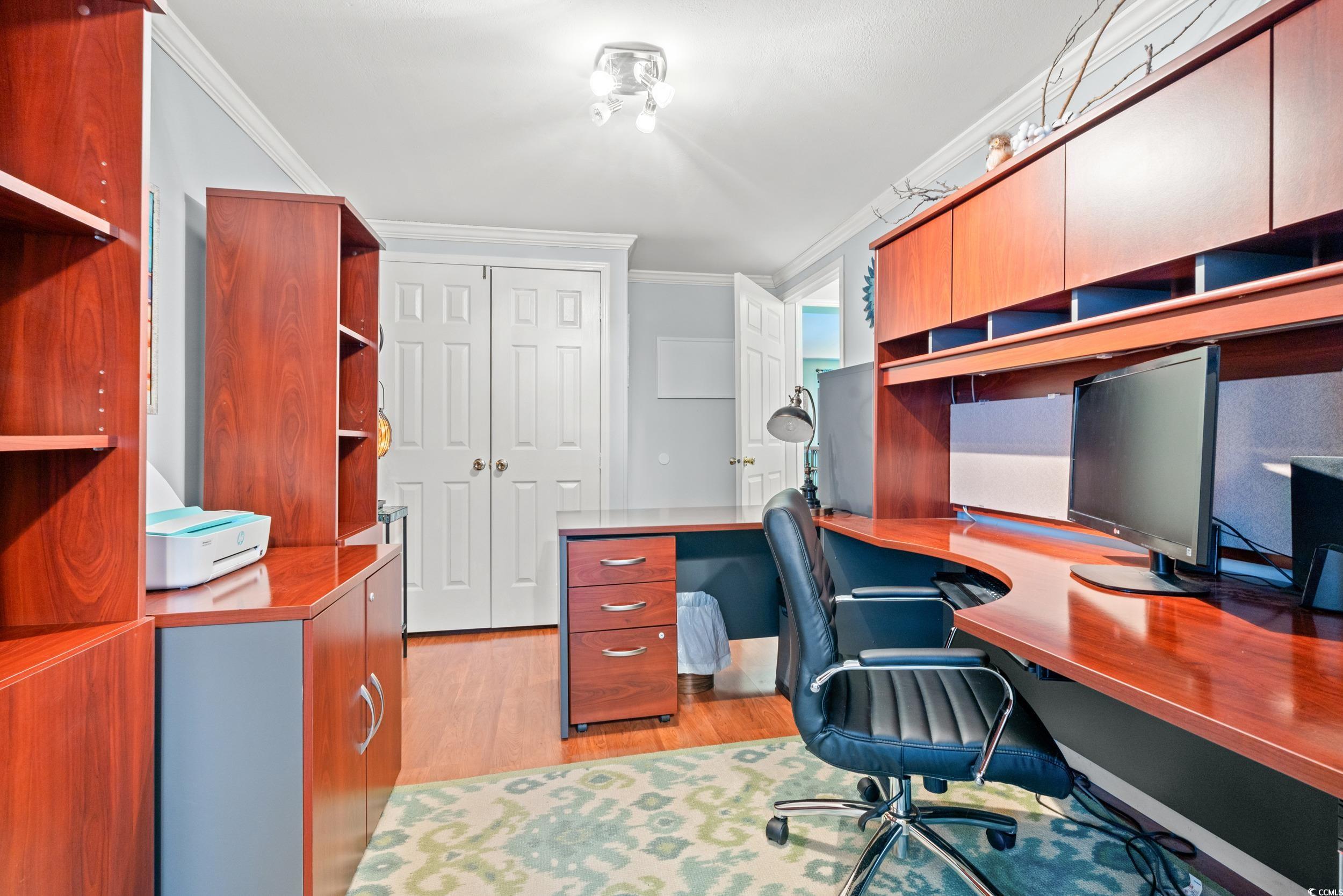 467 Freedom Circle Myrtle Beach, SC 29588 - Photo 23 of 38 Office with light wood-style flooring, crown molding, and built in study area