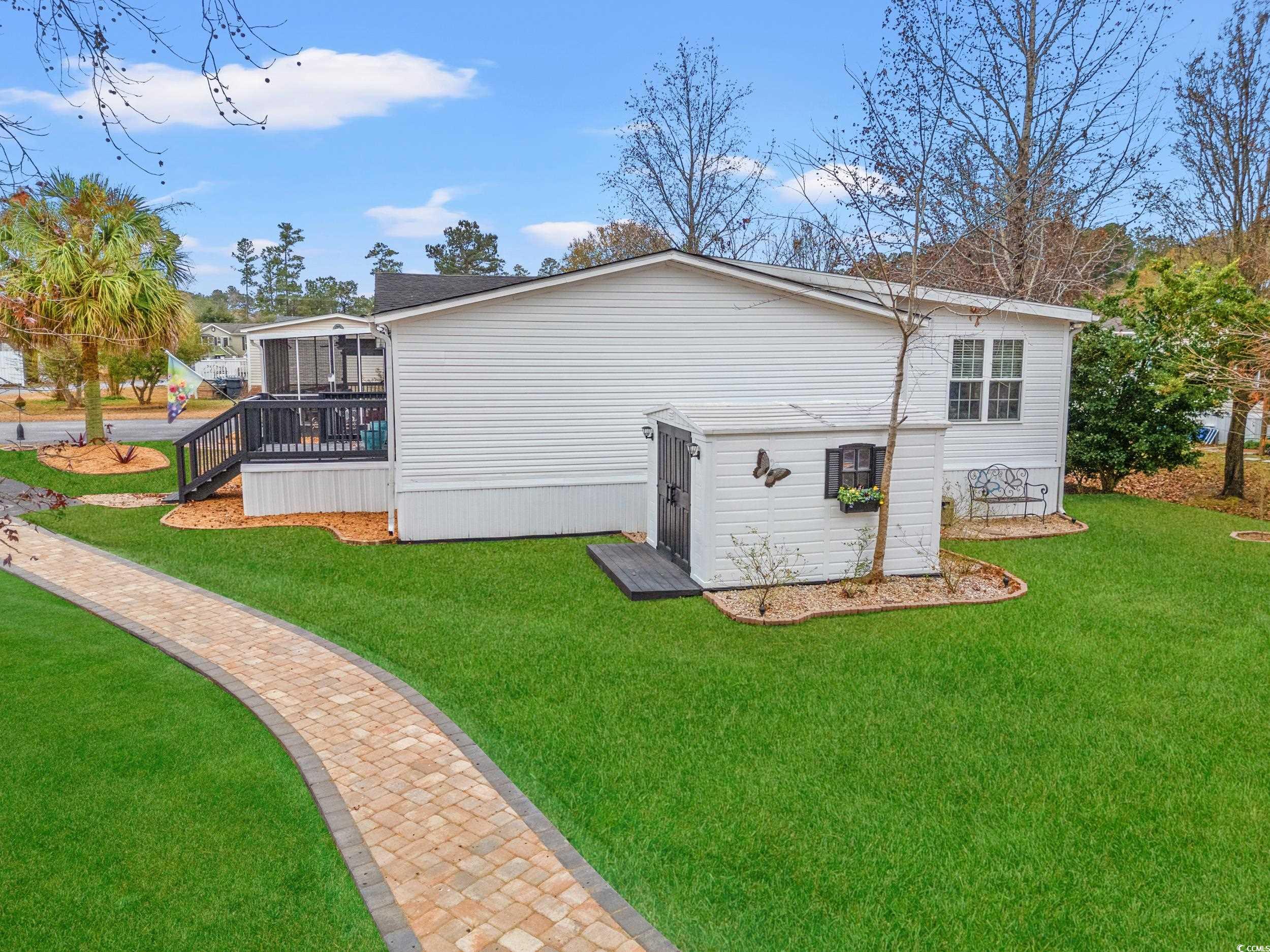 467 Freedom Circle Myrtle Beach, SC 29588 - Photo 31 of 38 View of home's exterior with a lawn and a deck