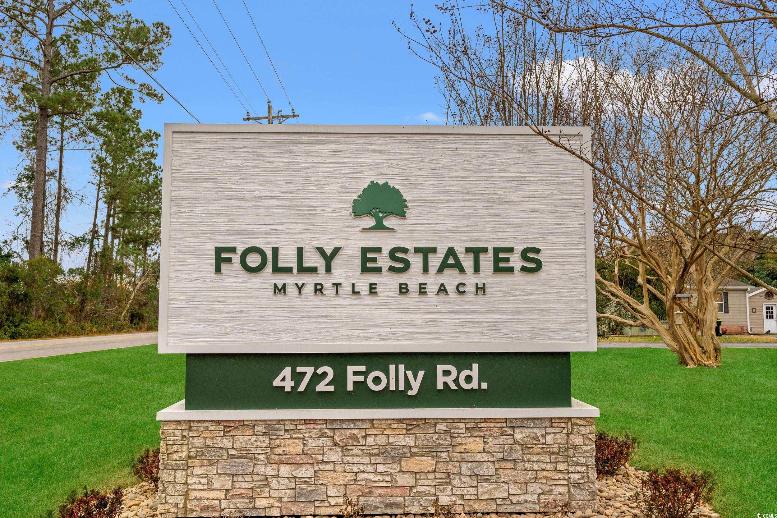 467 Freedom Circle Myrtle Beach, SC 29588 - Photo 33 of 38 Community / neighborhood sign with a lawn