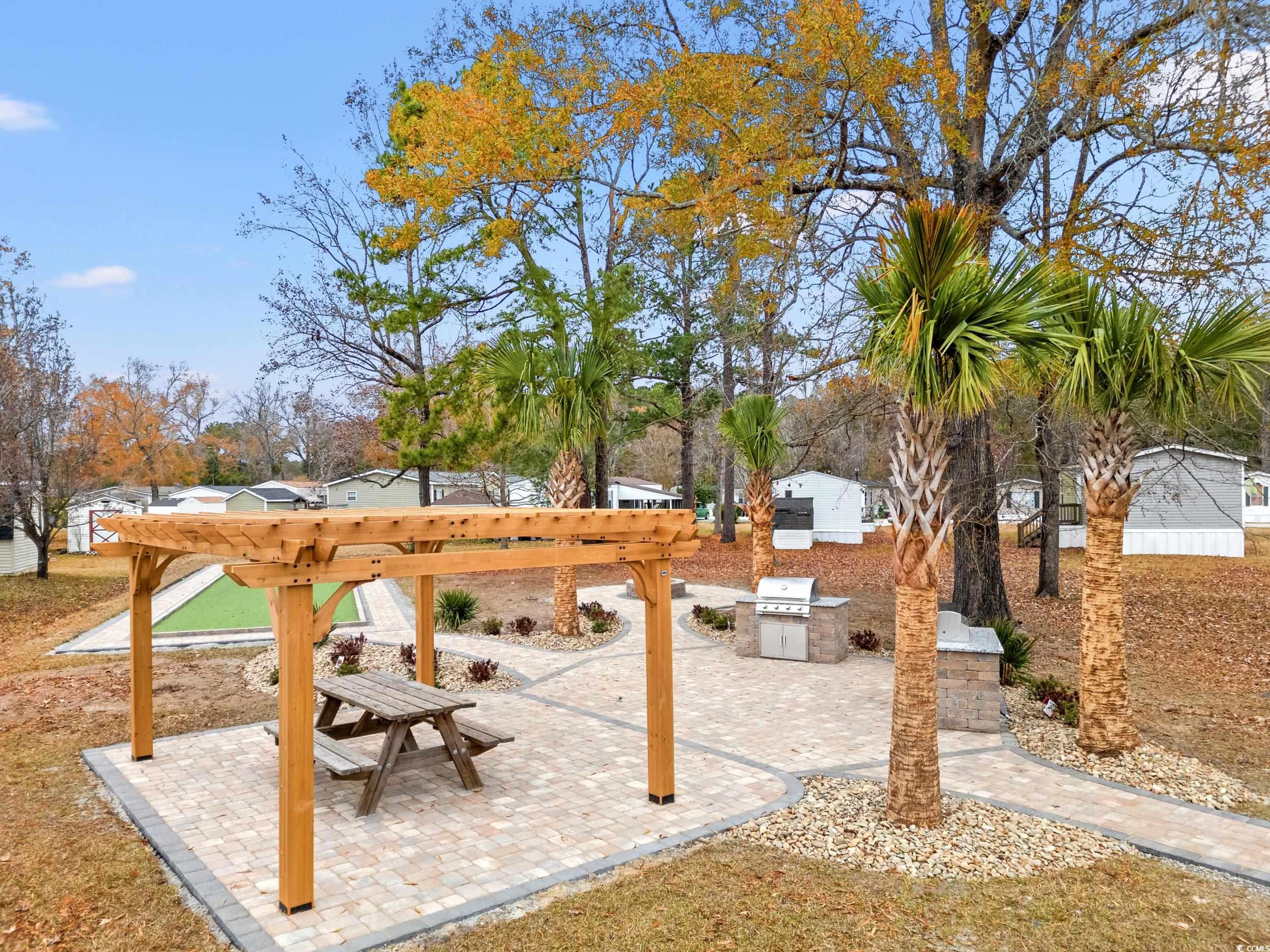 467 Freedom Circle Myrtle Beach, SC 29588 - Photo 34 of 38 View of yard with a patio area, a pergola, and area for grilling