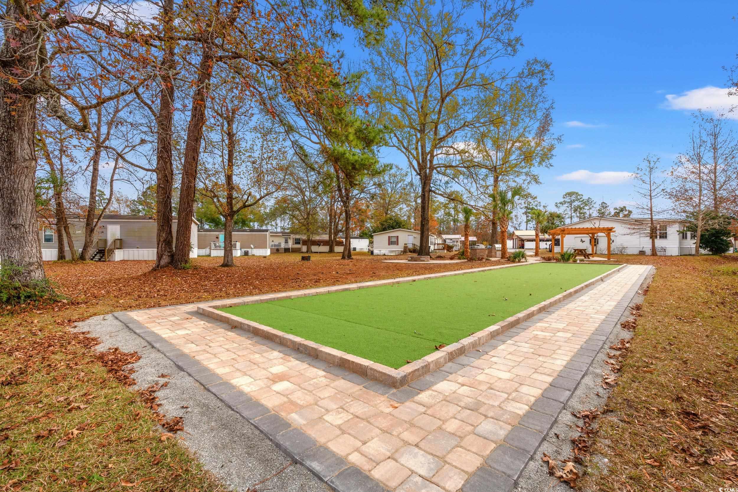 467 Freedom Circle Myrtle Beach, SC 29588 - Photo 35 of 38 View of yard featuring a bocce ball area and a residential view