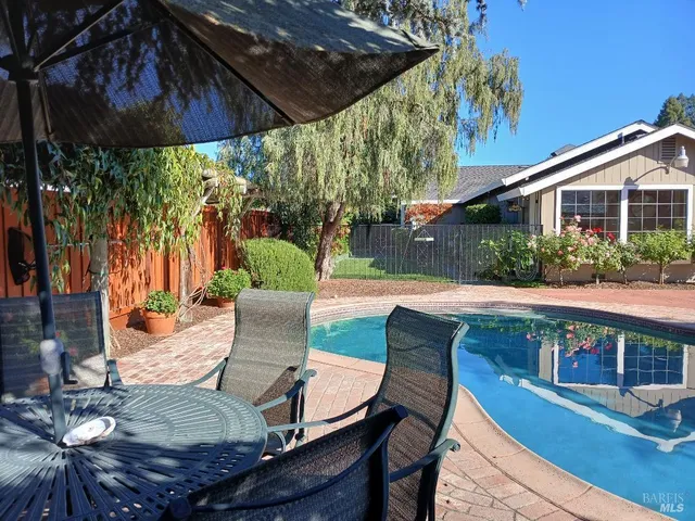 a view of yard with patio