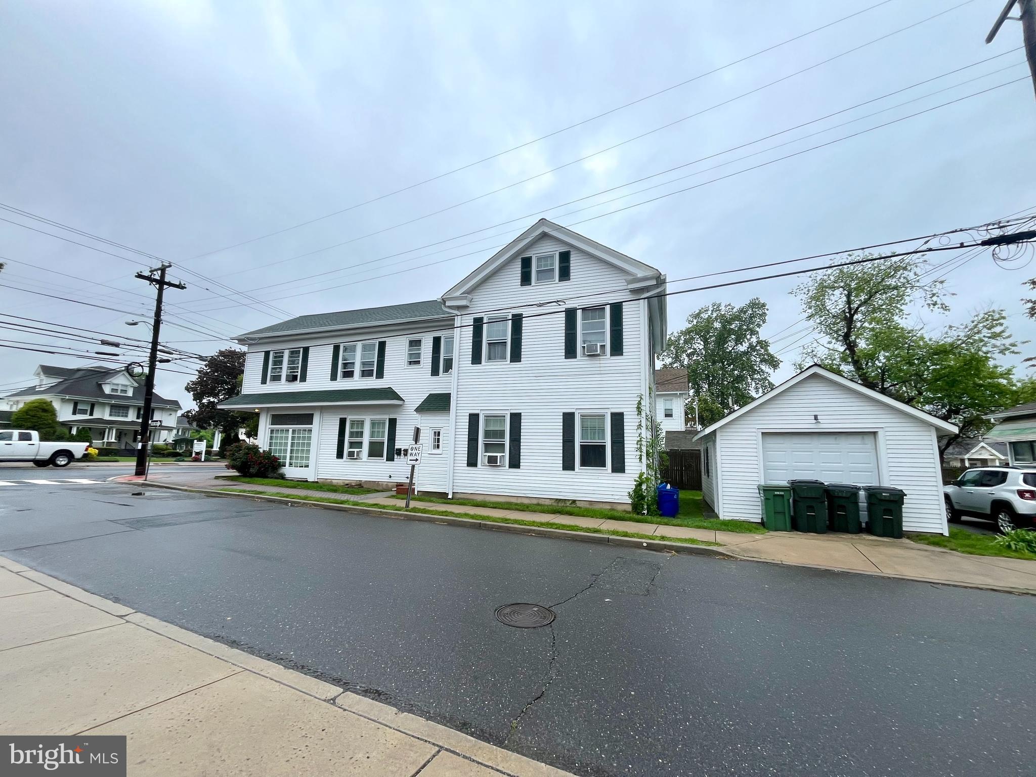 135 East Main Street Tuckerton, NJ 08087 - Photo 4 of 6 a front view of a house with a garden and lake view