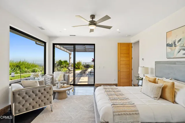 a bedroom with a bed and a couch