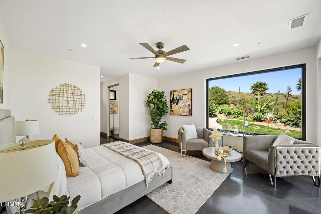 5572 Rainier Street Ventura, CA 93003 - Photo 14 of 29 a bedroom with a bed and a large window