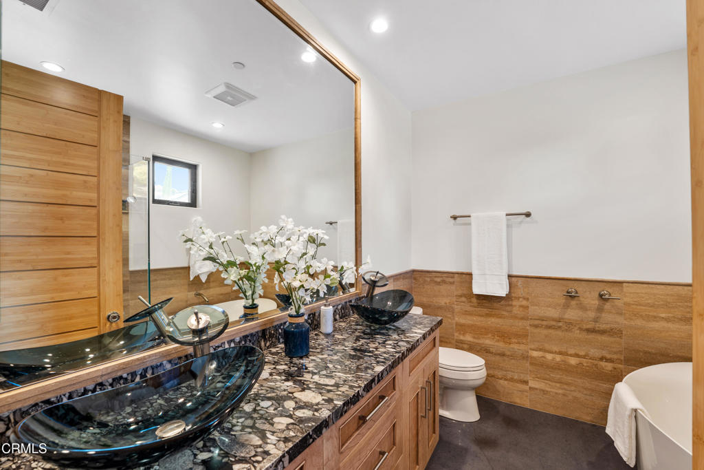 5572 Rainier Street Ventura, CA 93003 - Photo 16 of 29 a room with a couch and potted plant on the table