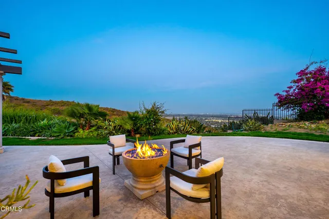 a view of a lake with outdoor seating