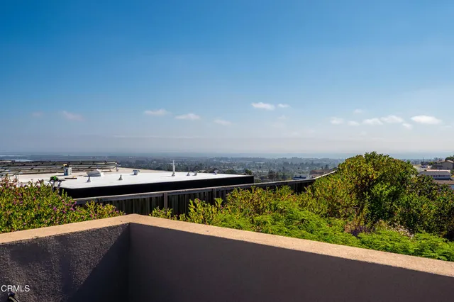 a view of a balcony with an ocean view
