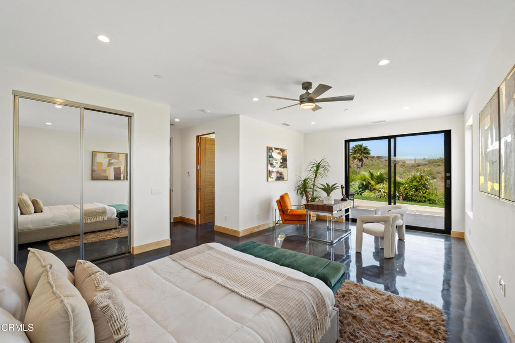5572 Rainier Street Ventura, CA 93003 - Photo 9 of 29 a bedroom with furniture a ceiling fan and a large window