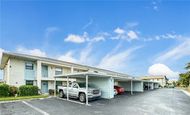 a view of a car park in front of house
