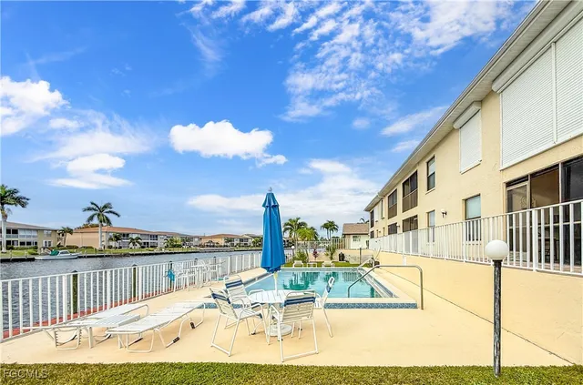 a view of a swimming pool with a lounge chairs