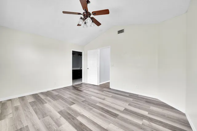 a view of a big room with carpet