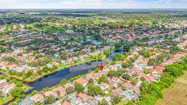 an aerial view of a house with a yard and plants