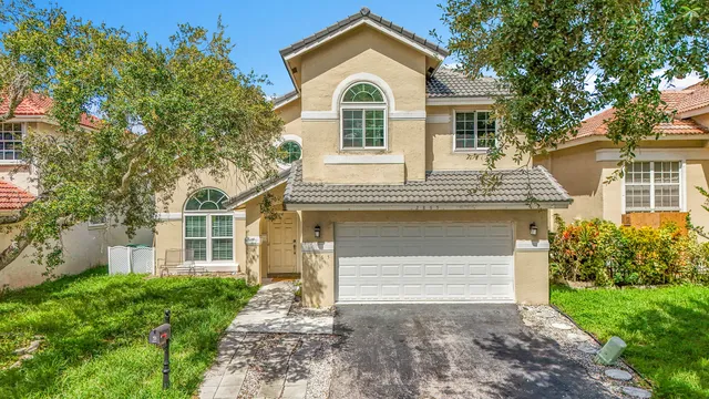an aerial view of residential houses with outdoor space and river