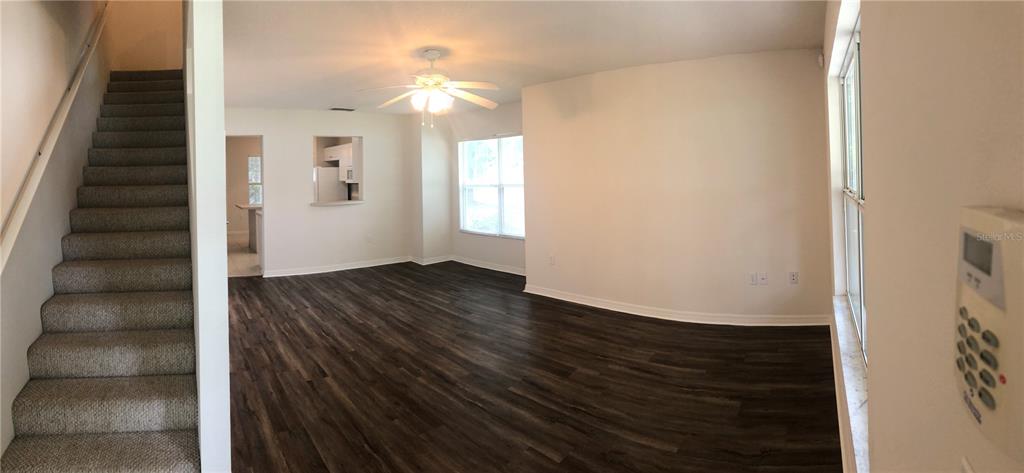 2375 Southwest 42nd Way, Unit 160 Gainesville, FL 32607 - Photo 5 of 14 wooden floor in an empty room with a window