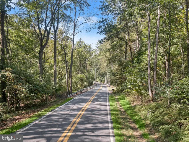 a view of a pathway both side of the house