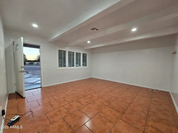a view of an empty room and window