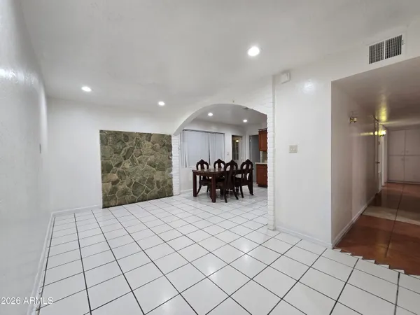 a view of an empty room and a sink