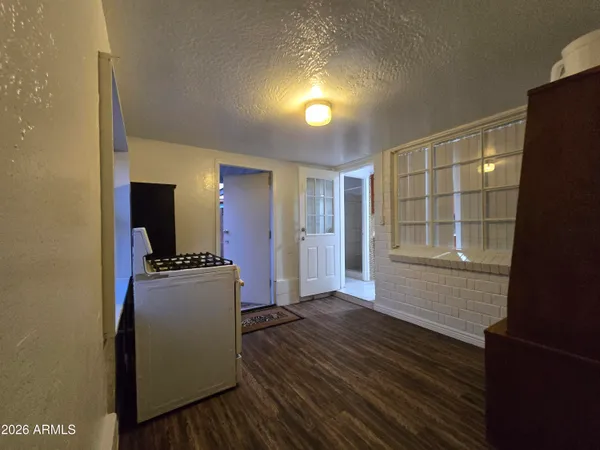 a view of a livingroom with wooden floor