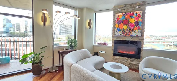 a living room with furniture and a fireplace