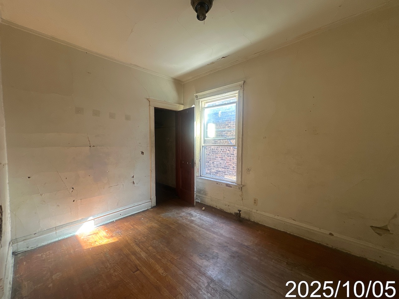 7435 South Wentworth Avenue Chicago, IL 60621 - Photo 15 of 18 an empty room with wooden floor and windows