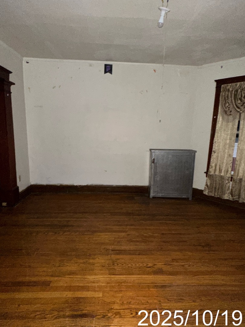 7435 South Wentworth Avenue Chicago, IL 60621 - Photo 4 of 18 a view of room with wooden floor