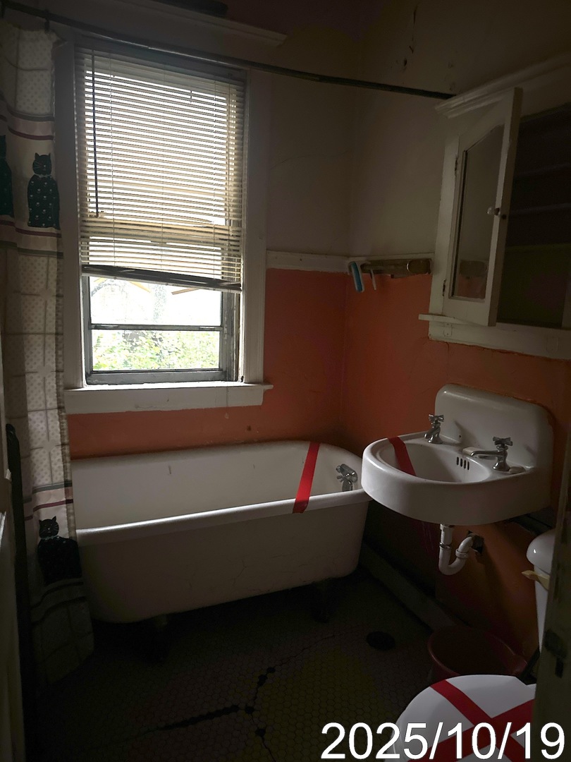 7435 South Wentworth Avenue Chicago, IL 60621 - Photo 6 of 18 a bathroom with a sink and a toilet