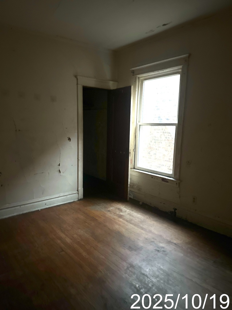 7435 South Wentworth Avenue Chicago, IL 60621 - Photo 8 of 18 an empty room with a window