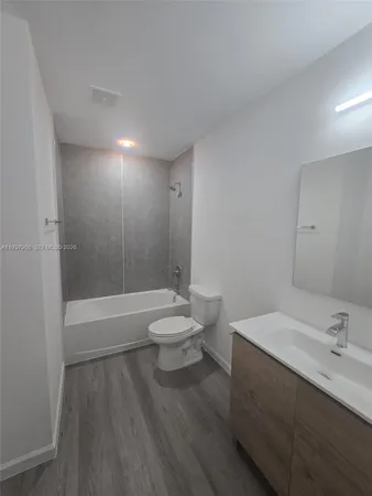 a bathroom with a sink a toilet and a bathtub