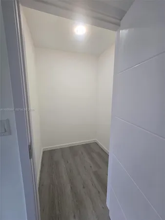 a view of small space with wooden floor