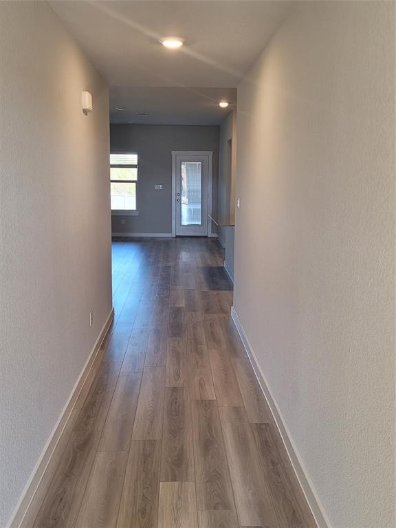 517 Coda Crossing Georgetown, TX 78633 - Photo 11 of 17 a view of empty room with window and wooden floor