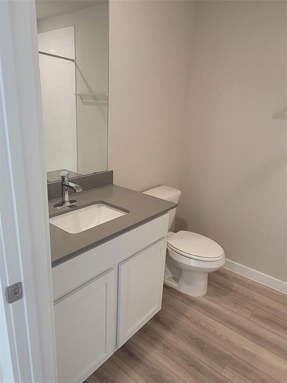 517 Coda Crossing Georgetown, TX 78633 - Photo 14 of 17 a bathroom with a granite countertop toilet and sink