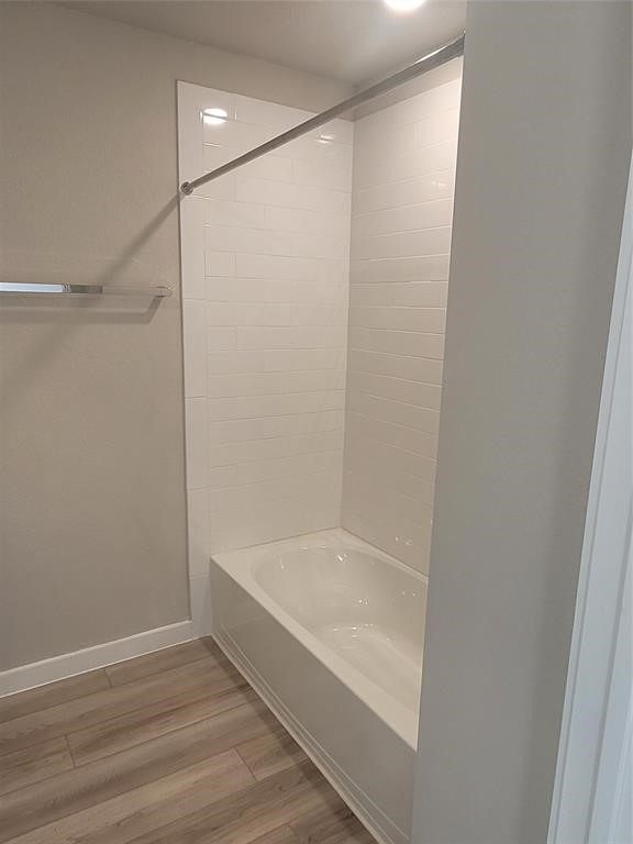 517 Coda Crossing Georgetown, TX 78633 - Photo 15 of 17 a bathroom with a bathtub and a shower