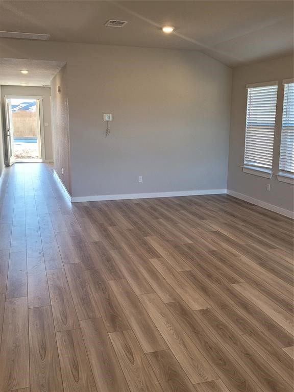 517 Coda Crossing Georgetown, TX 78633 - Photo 6 of 17 a view of an empty room with wooden floor and a window