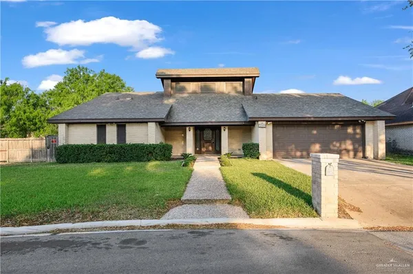 a front view of a house with yard