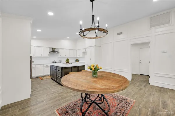 a view of room with sink and wooden floor