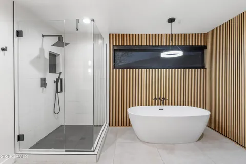 a bathroom with a bathtub and a sink