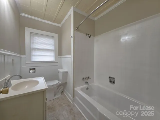 a bathroom with a sink a toilet and bathtub